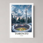 A framed art print of the Toronto Rogers Centre and CN Tower skyline at twilight with a minimalist white frame, emphasizing the city lights and dramatic clouds.