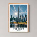 A framed photo of the Toronto cityscape with a rustic red oak wood frame, highlighting the urban and natural blend.