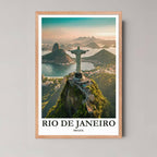 A framed illustration of the Christ the Redeemer view with a rustic red oak wood frame, highlighting the warm, golden light across the landscape.