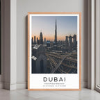 A framed poster of the Dubai skyline at sunset with a red oak wood frame, styled in a luxurious modern interior.