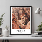 A framed travel poster of Petra displayed on an office wall, adding an element of professional and artistic flair.