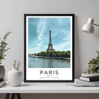 A framed travel poster of Paris displayed on an office wall, adding an element of professional and artistic flair.