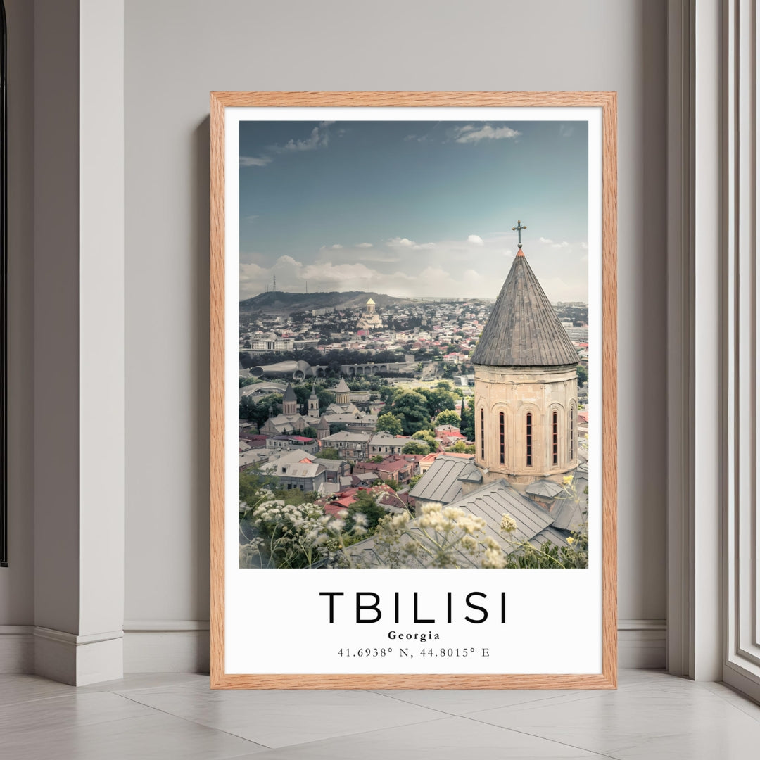 A framed print of Tbilisi, Georgia, with a rustic red oak wood frame, highlighting the city's historic charm.