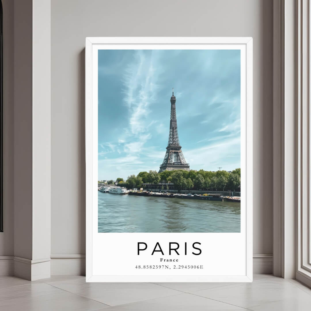 A framed art print of the Eiffel Tower and the River Seine with a minimalist white frame, perfect for a clean, modern decor style.