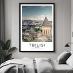 A curated art gallery wall that includes a framed Tbilisi poster, showcasing a creative and personalized collection of prints.