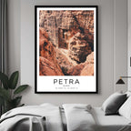 A curated art gallery wall that includes a framed Petra poster, showcasing a creative and personalized collection of prints.