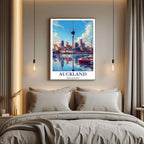 A curated art gallery wall that includes a framed Auckland poster, showcasing a creative and personalized collection of prints.
