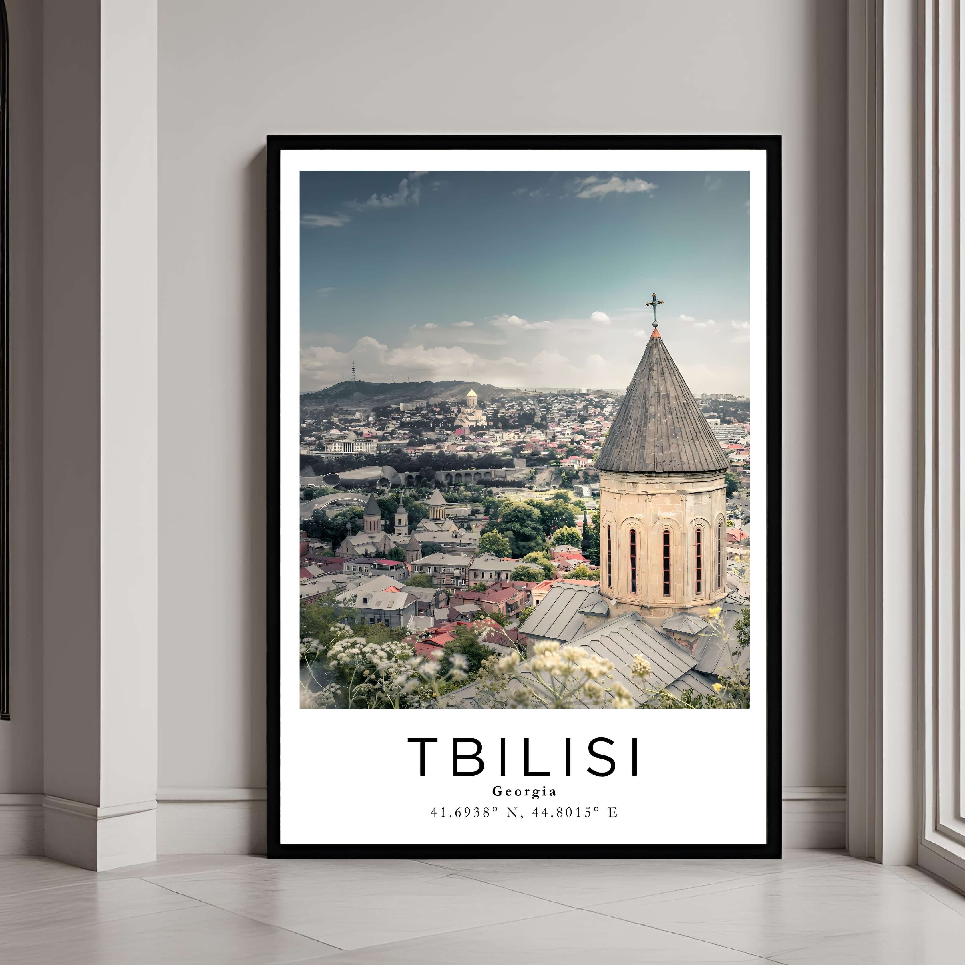 A framed art print of the Georgian cityscape with a classic black frame, adding a sleek and elegant touch to home decor.