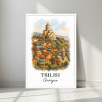 Watercolor-style print of the cascading Tbilisi houses and Narikala Fortress in a minimalist white frame. Captures the serene, cultural history of Georgia.