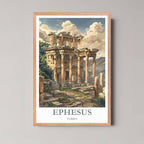 A framed illustration of the Ephesus ruins with a light wood frame, highlighting the architectural detail and Mediterranean landscape.