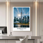 A framed travel poster of Toronto displayed on a wall in a home office, adding an element of professional and artistic flair.