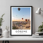A framed travel poster of Göreme, Turkey, displayed on a wall in a home office, adding an element of professional and artistic flair.