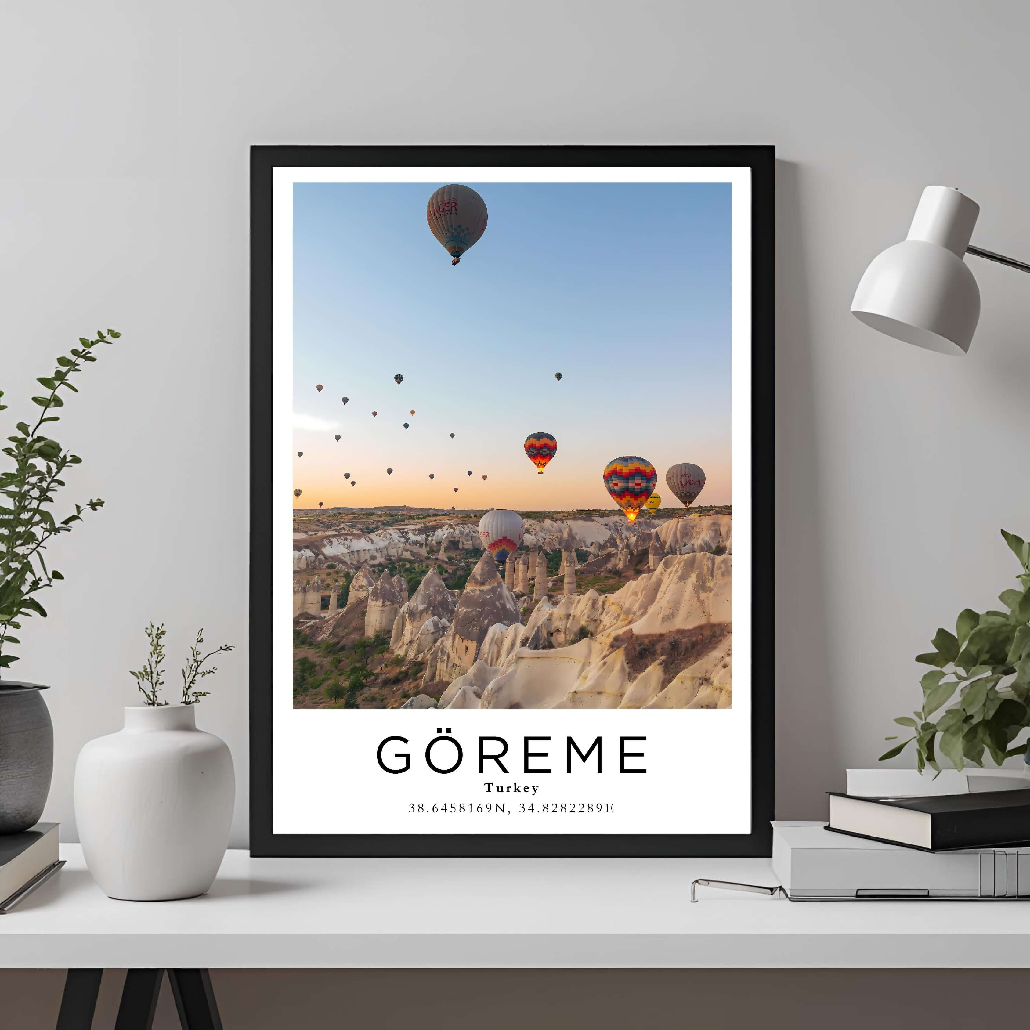 A framed travel poster of Göreme, Turkey, displayed on a wall in a home office, adding an element of professional and artistic flair.
