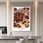 A framed travel poster of Petra displayed on a wall in a home office, adding an element of historical and inspiring focus.