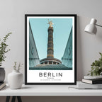 A framed travel print of Berlin's famous Victory Column displayed in a home office, adding an element of professional and artistic flair.