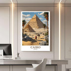 A framed travel poster of Cairo displayed on a wall in a home office, adding an element of historical and inspiring flair.