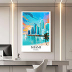 A framed travel poster of Miami displayed on a wall in a home office, adding an element of creative and vibrant flair.