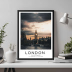 A framed travel poster of London displayed on a wall in a home office, adding an element of professional and artistic flair.