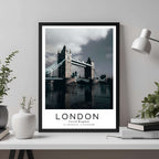 A framed travel poster of the Tower Bridge displayed on an office wall, adding an element of professional and artistic flair.