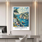A framed travel poster of Costa Brava displayed on a wall in a home office, adding an element of creative and sophisticated flair.