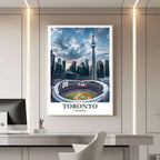 A framed travel poster of Toronto displayed on a wall in a home office, adding an element of creative, inspiring, and dynamic Canadian culture.