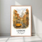 Framed Lisbon tram art in a natural Red Oak wood frame. Emphasizes the warm, sun-drenched tones of the Portuguese capital.