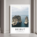A framed poster of Beirut’s coast hanging above a couch, enhancing the modern and sophisticated look of a living room.