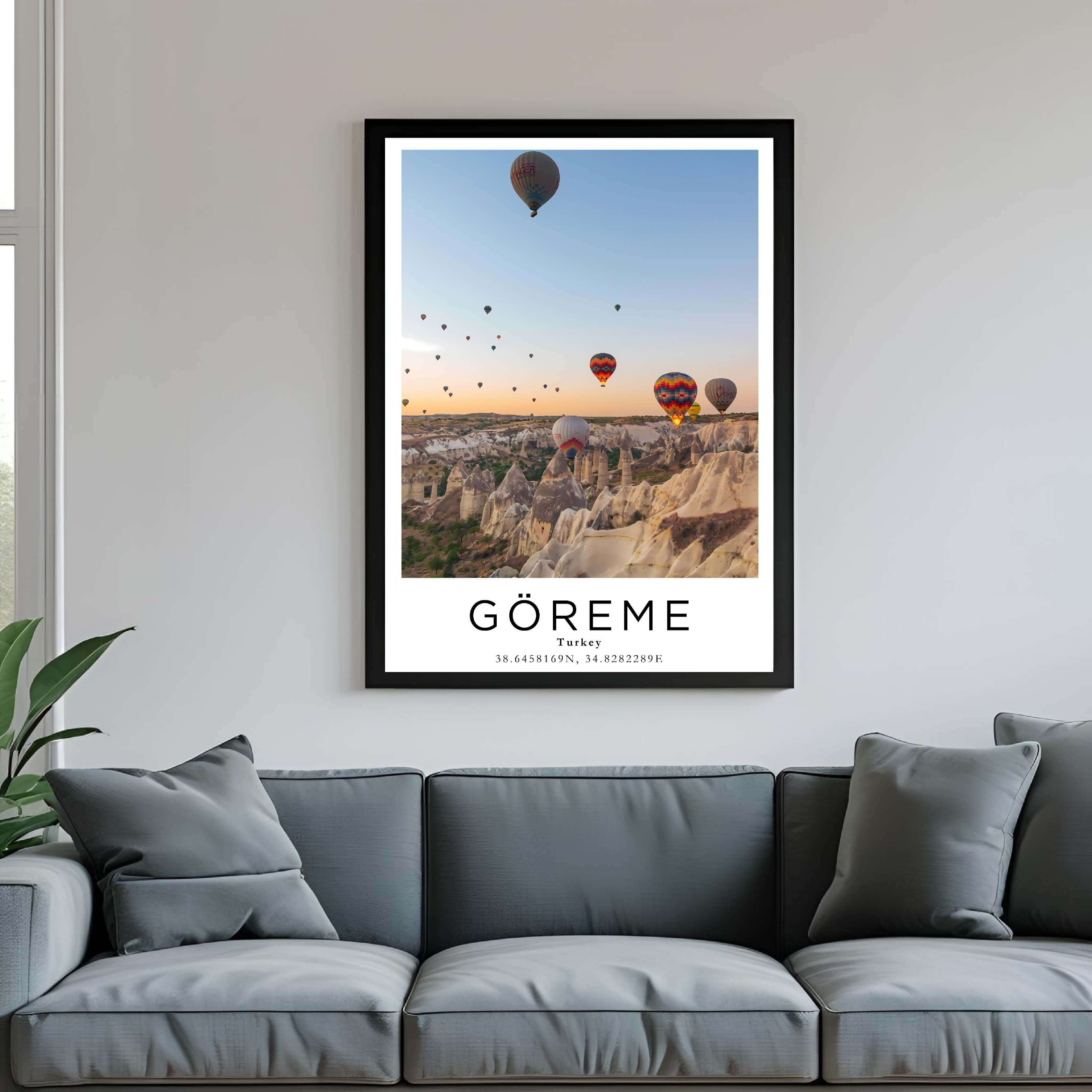 A framed poster of hot air balloons in Turkey hanging above a couch, enhancing the modern and sophisticated look of a living room.