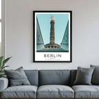 A framed poster of Berlin's Victory Column hanging above a couch, enhancing the modern and sophisticated look of a living room.