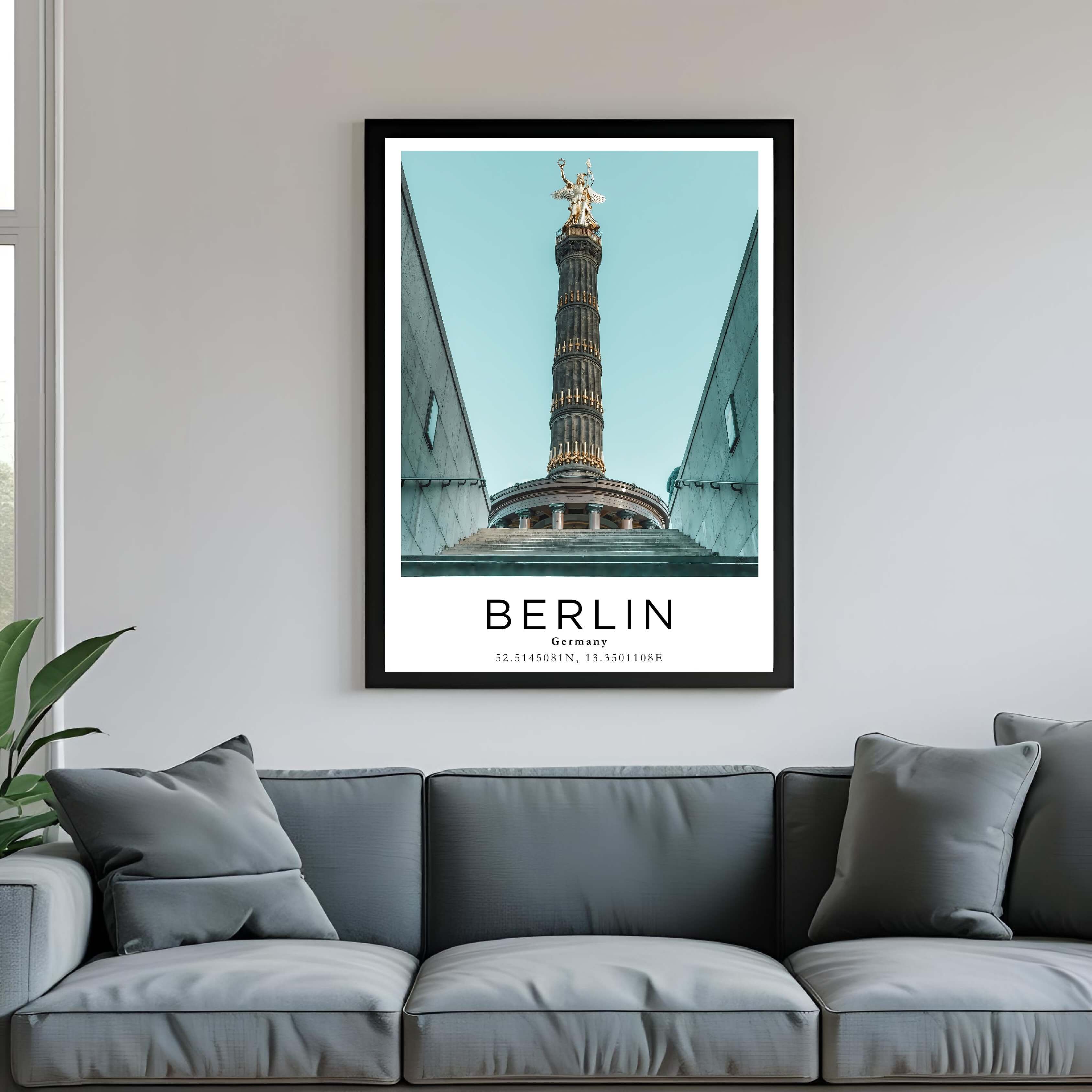 A framed poster of Berlin's Victory Column hanging above a couch, enhancing the modern and sophisticated look of a living room.