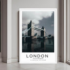A framed wall art print of the Tower Bridge over the River Thames with a minimalist white frame.