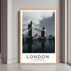 A framed poster of the Tower Bridge in London, UK, with a red oak wood frame, styled in a luxurious modern interior.