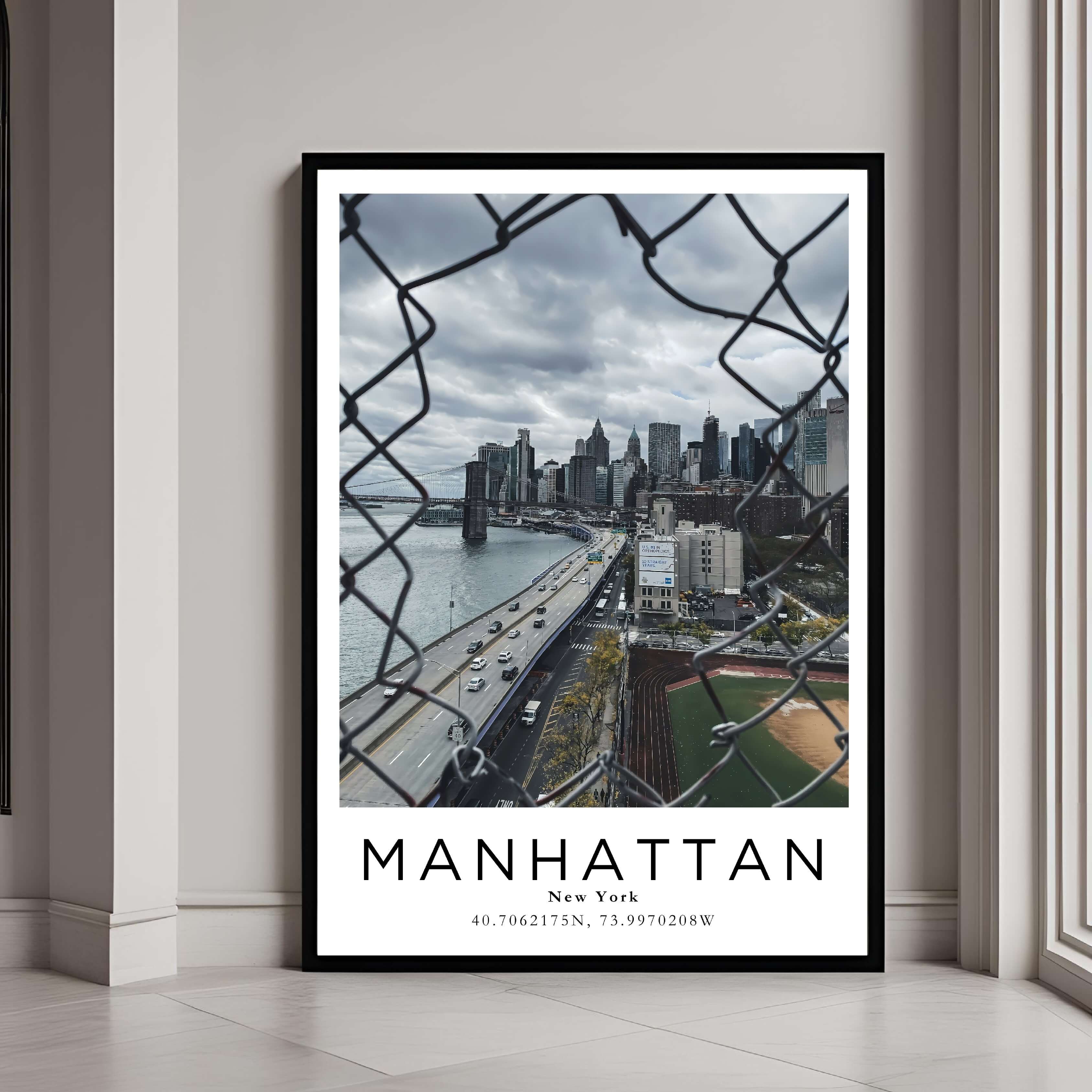 A framed poster of the Manhattan skyline and Brooklyn Bridge with a classic black frame, styled in a modern interior.