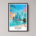 A framed, vibrant illustration of the Miami skyline from the beach with a palm tree, featuring bright blues and pinks, and a black frame.