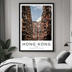  A framed art print of Hong Kong's unique buildings decorating a bedroom wall, creating a simple and elegant atmosphere.