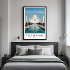 A framed art print of the Taj Mahal decorating a bedroom wall, creating a peaceful and luxurious atmosphere.