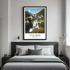 A framed art print of the Ticino village decorating a bedroom wall, creating a peaceful and luxurious atmosphere.