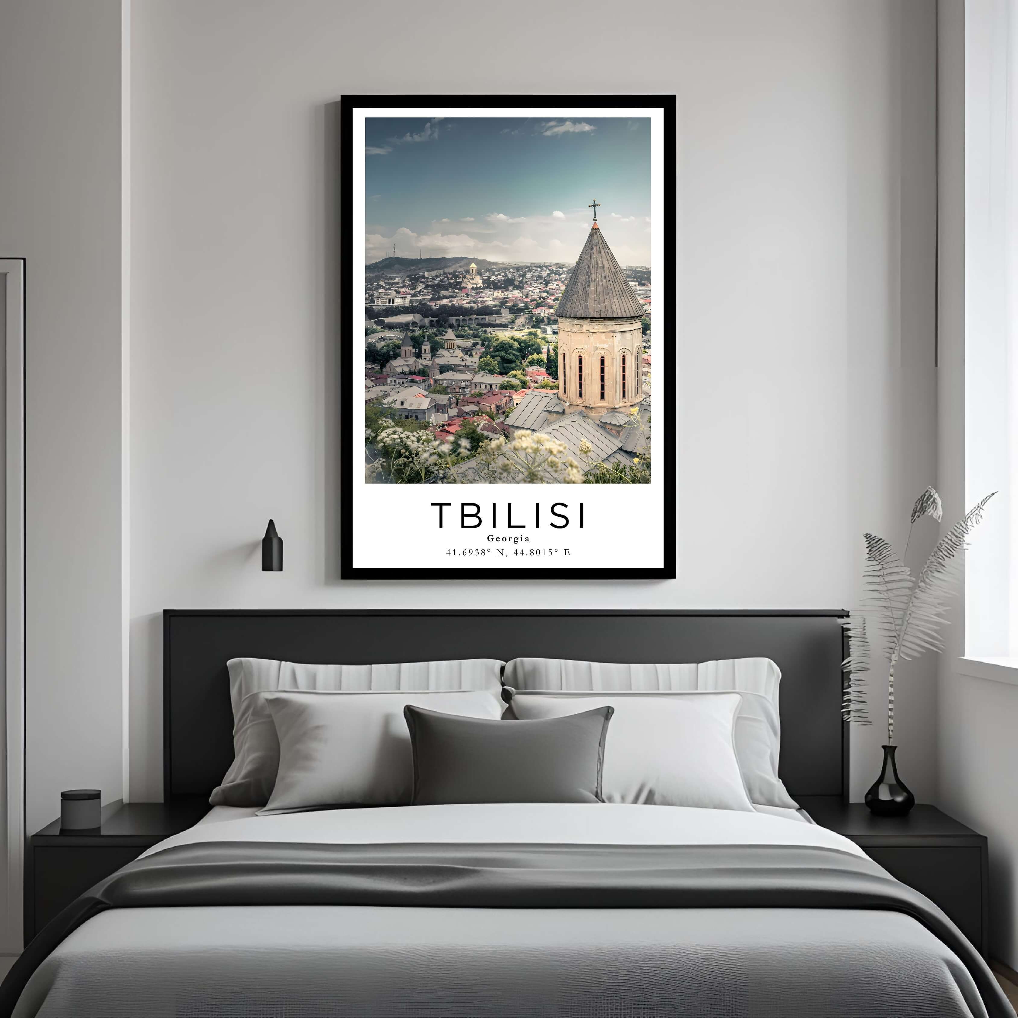  A framed art print of the Tbilisi cityscape decorating a bedroom wall, creating a peaceful and luxurious atmosphere.