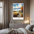 A framed art print of the North Carolina landscape decorating a bedroom wall, creating a peaceful, travel-inspired atmosphere.