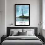 A framed art print of the Eiffel Tower decorating a bedroom wall, creating a serene and romantic atmosphere.