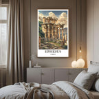A framed art print of the Ephesus ruins decorating a bedroom wall, creating a peaceful, history-inspired atmosphere.