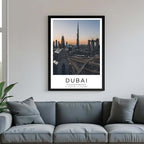 A framed poster of the Dubai skyline hanging above a couch, enhancing the modern and sophisticated look of a living room.