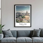 A framed poster of the Tbilisi Old Town hanging in a living room, enhancing the modern and sophisticated look of the space.