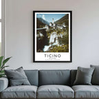  A framed poster of the Ticino village hanging in a living room, enhancing the modern and sophisticated look of the space.