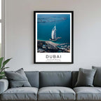 A framed poster of Dubai’s skyline, featuring the Burj Al Arab, hanging above a couch in a chic, modern living room.