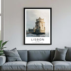 A framed poster of the Belém Tower hanging above a couch, enhancing the modern and sophisticated look of a living room.