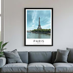  A framed poster of the Eiffel Tower hanging in a living room, enhancing the modern and sophisticated look of the space.