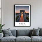 A framed poster of the Arc de Triomphe hanging in a living room, enhancing the modern and sophisticated look of the space.
