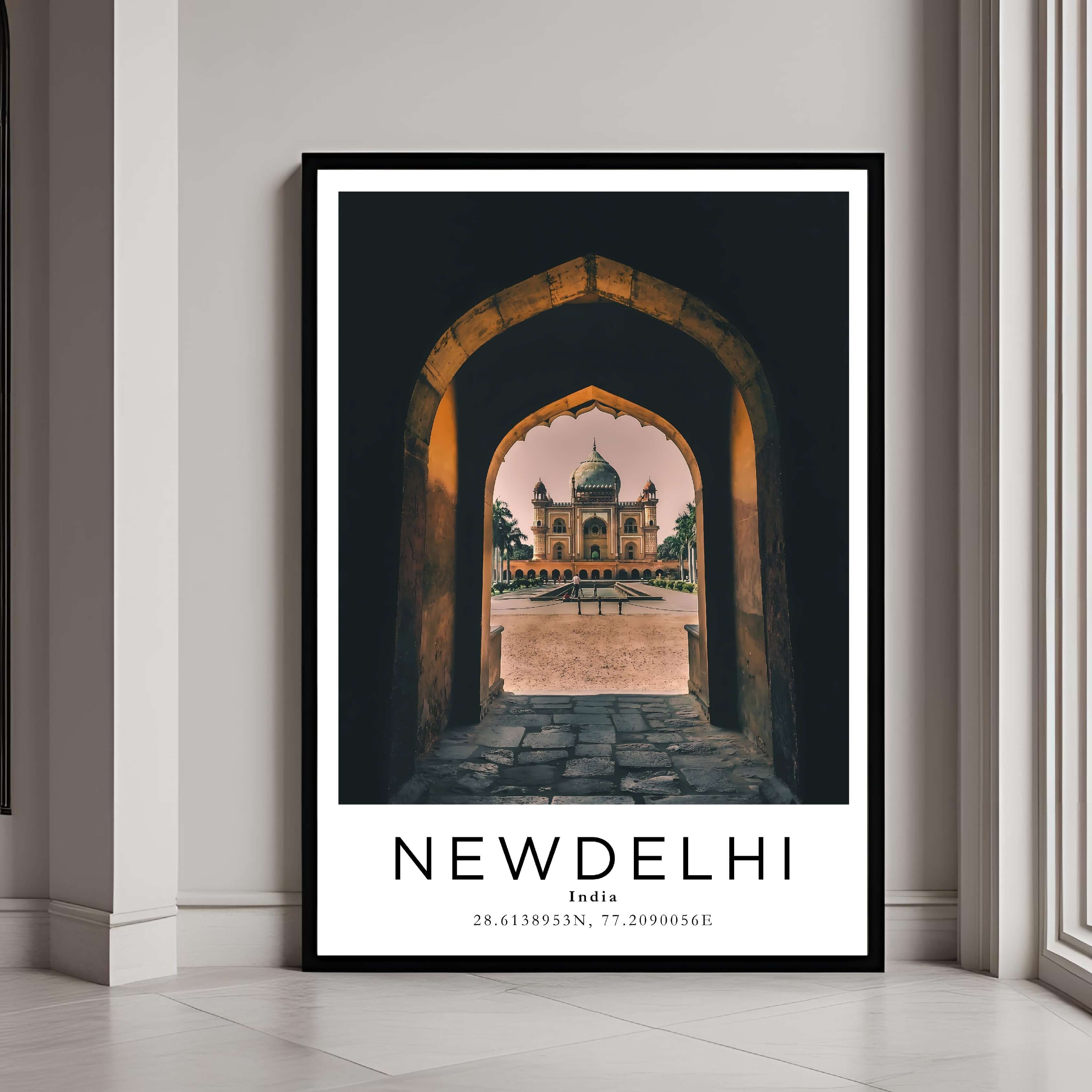 A framed poster of Humayun's Tomb in New Delhi, India, with a classic black frame, styled in a modern interior.