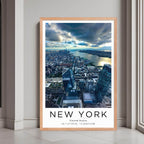 A framed poster of the New York City skyline at sunset, with a red oak wood frame, styled in a luxurious modern interior.